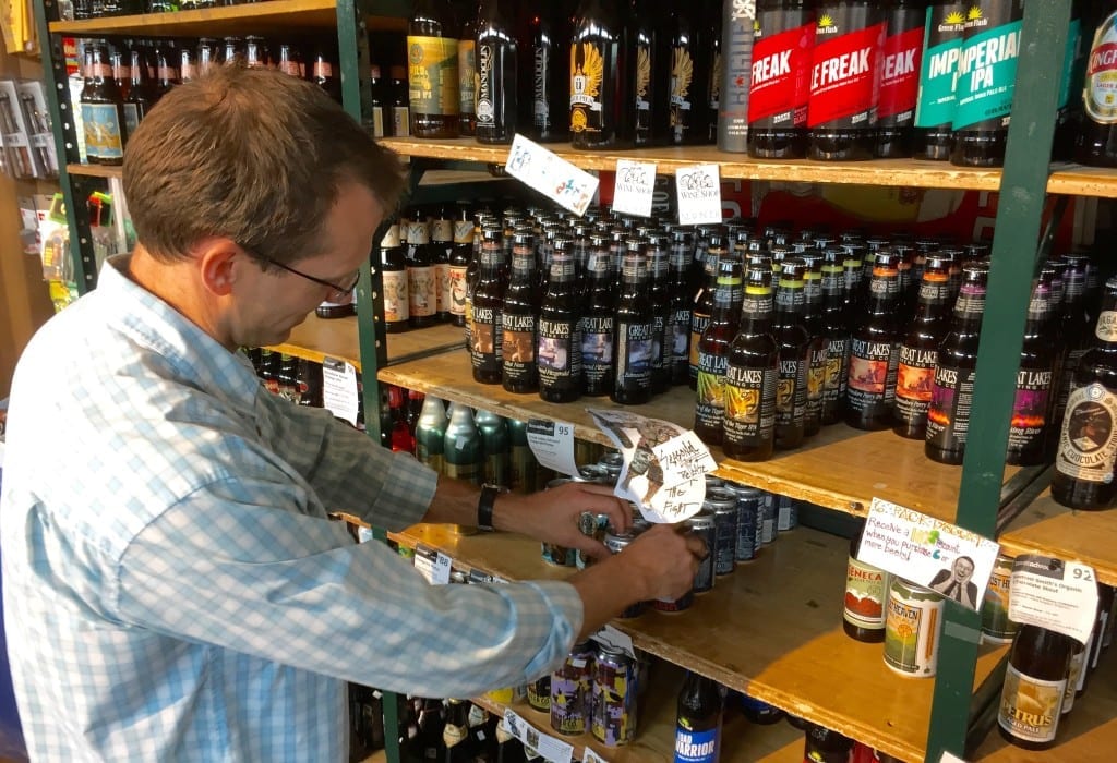 Ted Armbrecht works the beer shelves at The Wine Shop in Charleston's Capitol Market.
