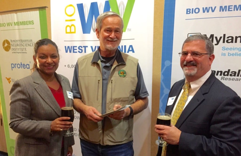 West Virginia craft beer was the attraction at Bio & Beer, a legislative reception hosted by the Wv Bioscience Association. Pictured (L to R) are Tami Brown of Merck, Wil Laska of Greenbrier Valley Brewing Co., and Brian Rosen of Perdue Pharma.
