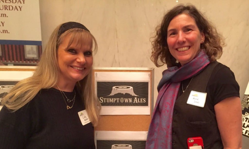 Ann Jones, on right, visits with Cindy Robeson of Stumptown Brewery.