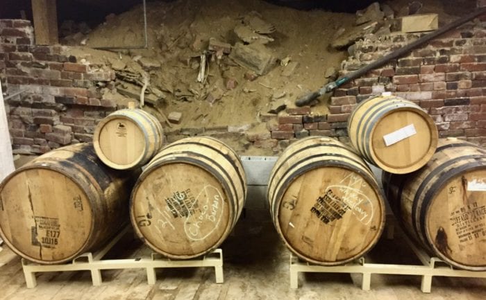 Whiskey barrels filled with beer in a 125 year old cellar.