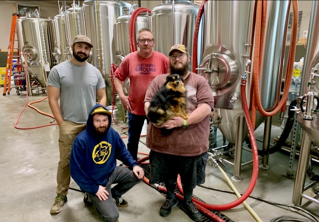 Pictured L to R are Fonda, Chris Taylor, Terry Smith, and Anthony Meador with his honorary brewhouse dog Doppel.