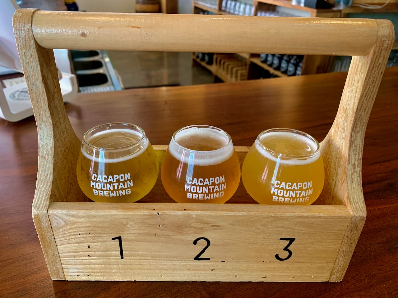 Cacapon Mountain Brewing flight carrier with Kölsch. English Ale, and IPA.